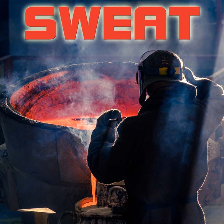 Steelworker stirs at hot cauldron